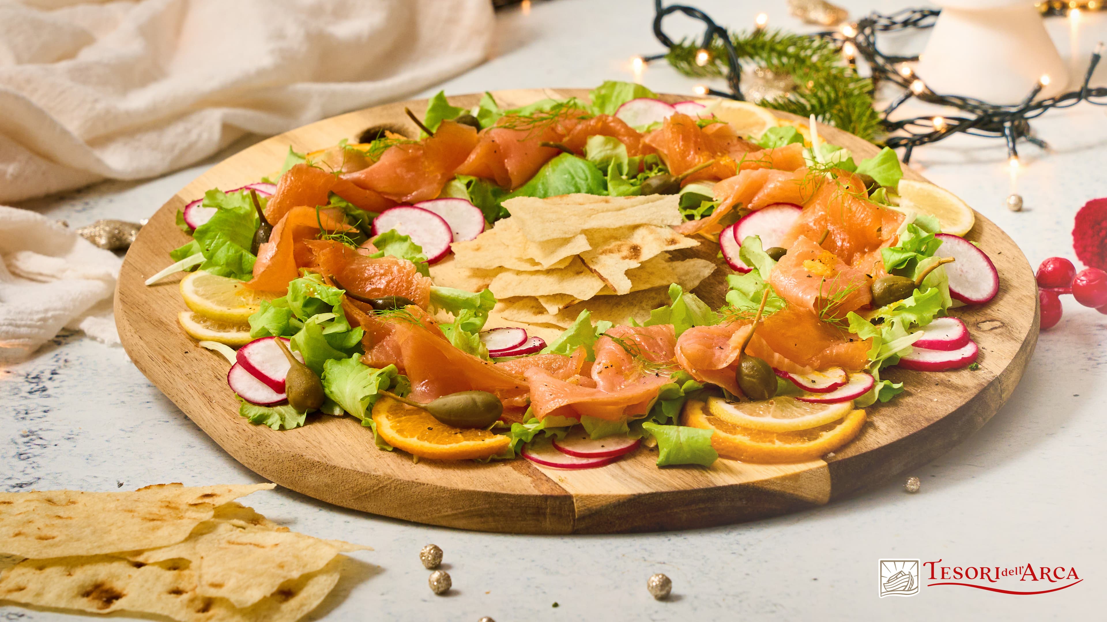 Ghirlanda di salmone norvegese, dressing agli agrumi e pane guttiau