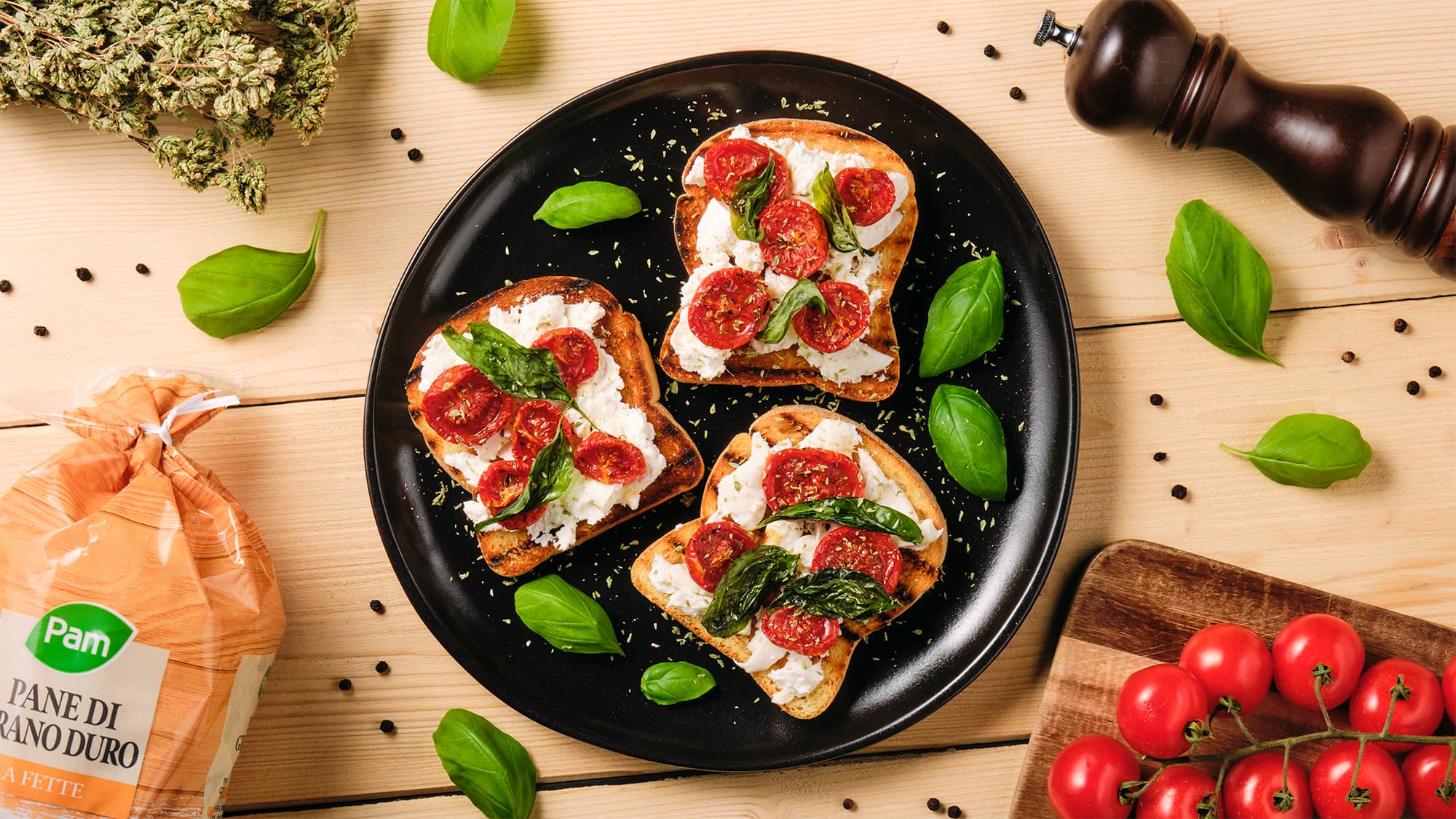 Bruschetta con burrata, pomodorini confit e basilico croccante