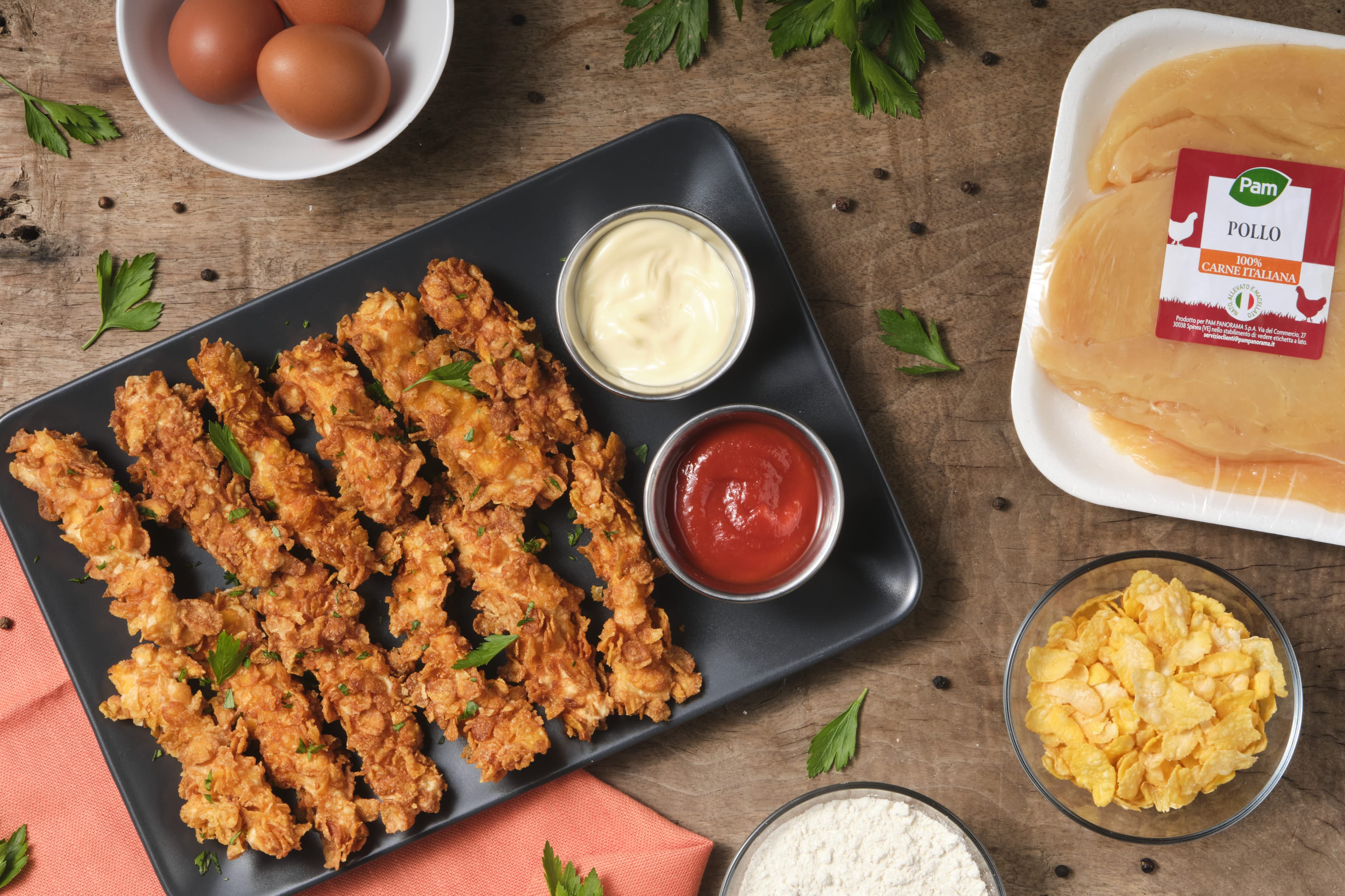 Straccetti di pollo impanati nei cornflakes