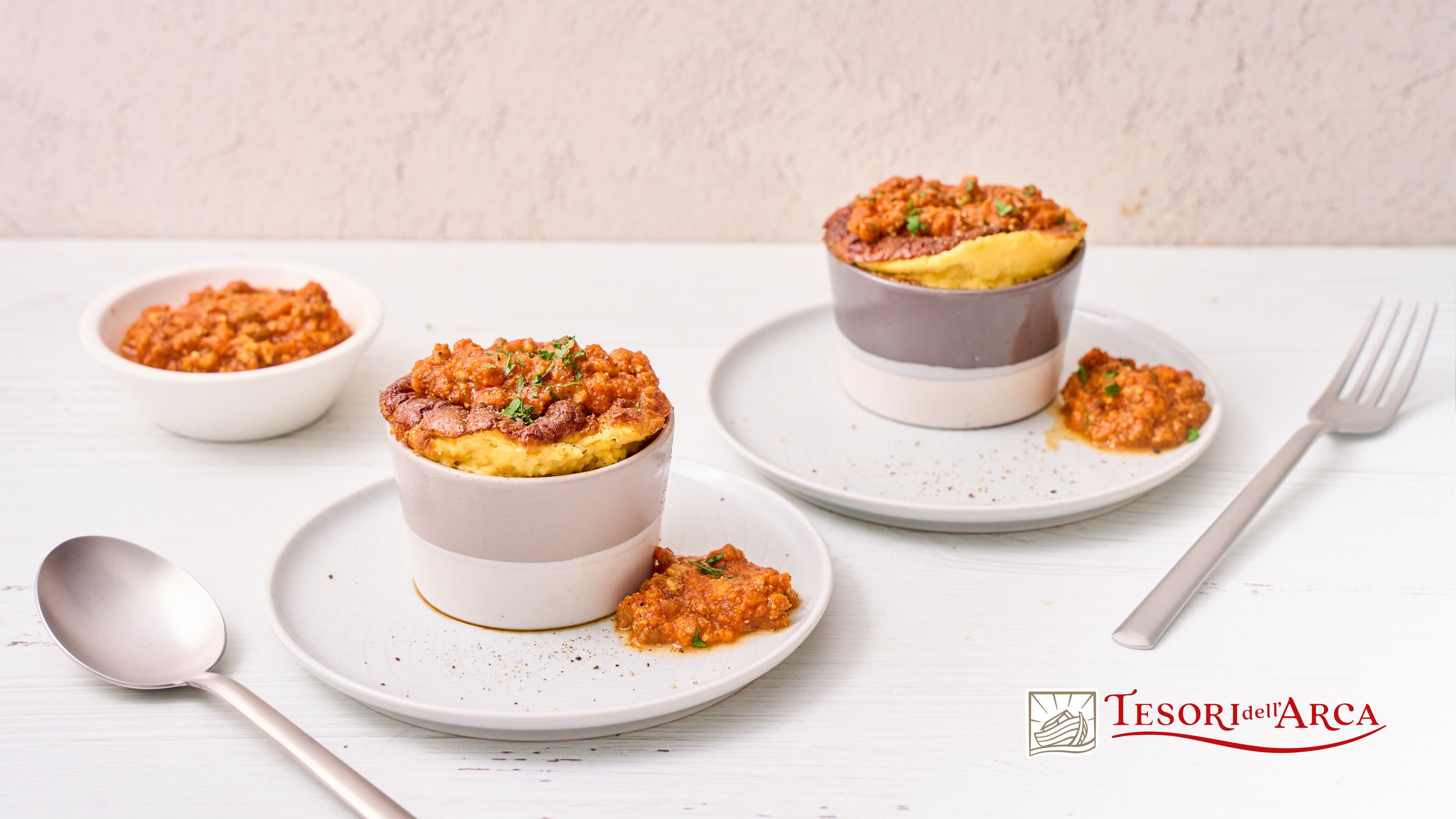 Soufflé al Parmigiano con ragù con Cinta Senese