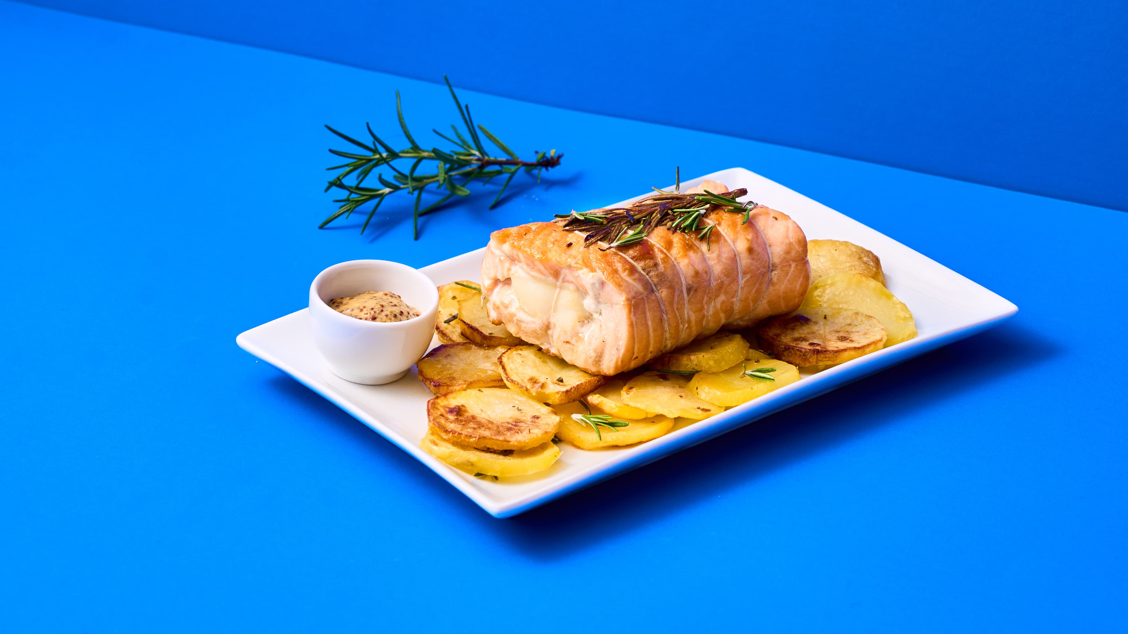 Arrosto di salmone e merluzzo con patate ed emulsione a base di senape