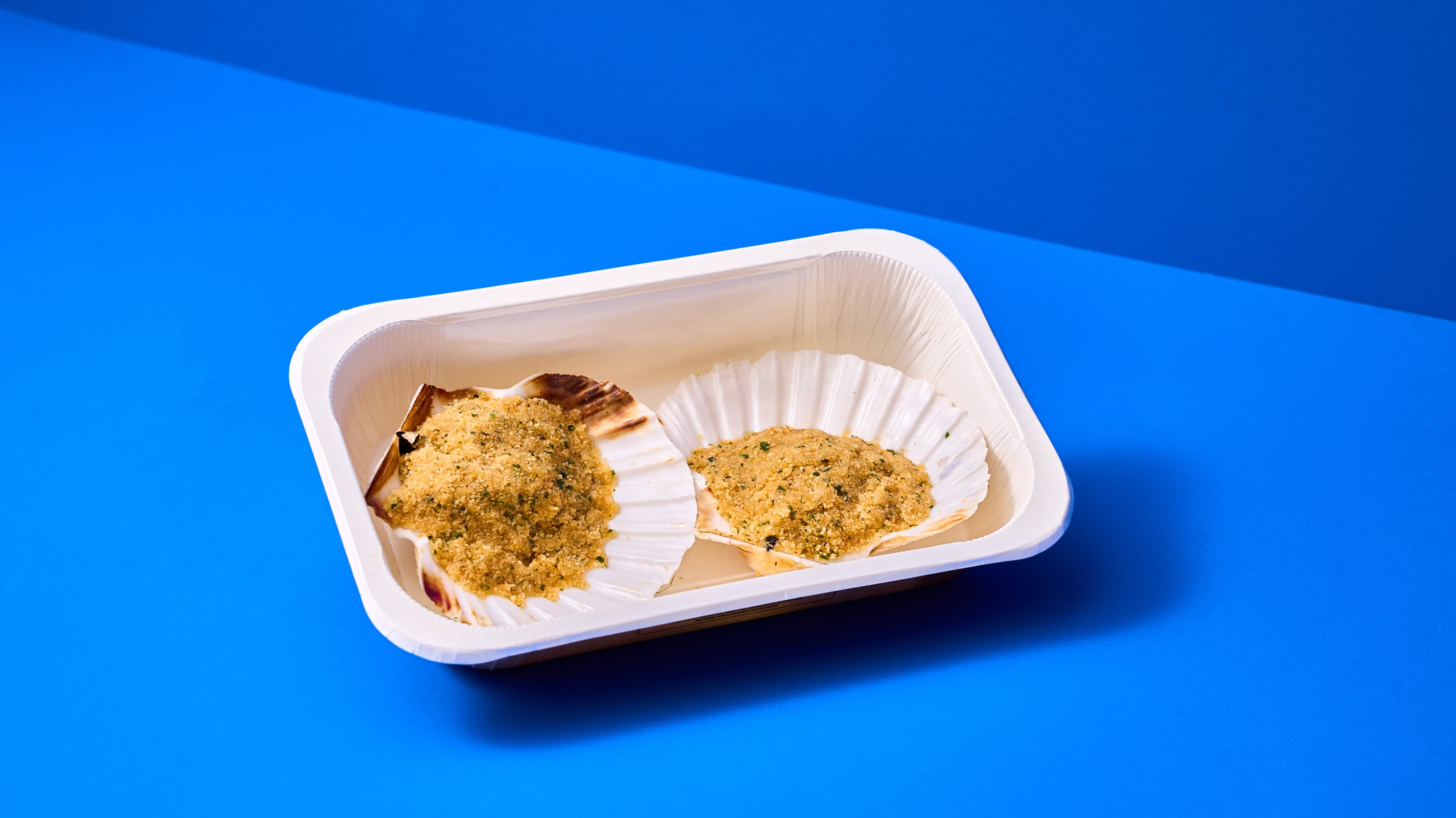 Capasanta gratinata con insalatina mista e limone