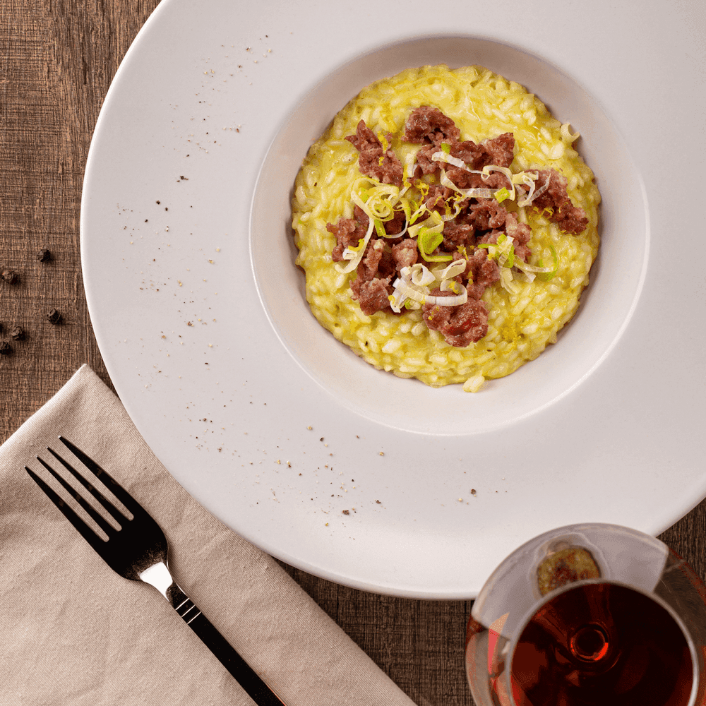 Risotto al porro con salsiccia e pompelmo